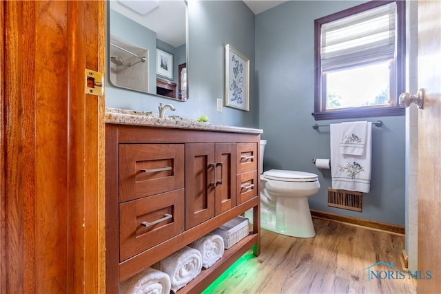 312 W Dudley St, Maumee, OH 43537 - full bathroom featuring wood finished floors and vanity