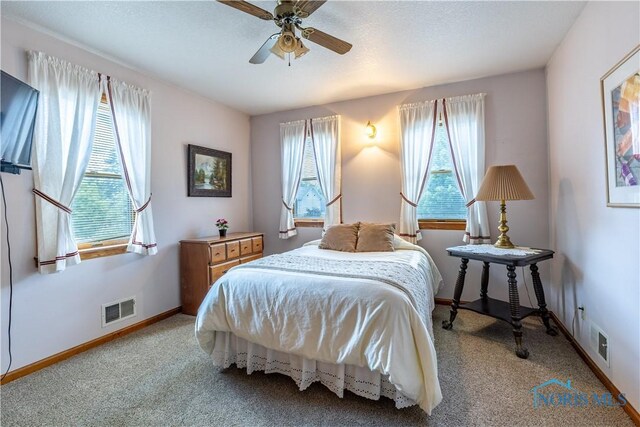312 W Dudley St, Maumee, OH 43537 - carpeted bedroom featuring baseboards and ceiling fan