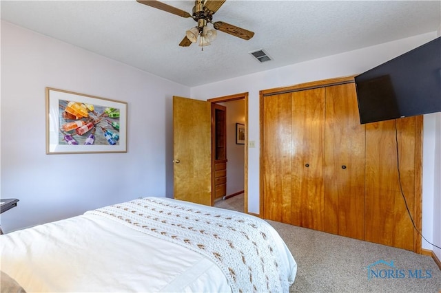 312 W Dudley St, Maumee, OH 43537 - carpeted bedroom with a closet, ceiling fan, and a textured ceiling