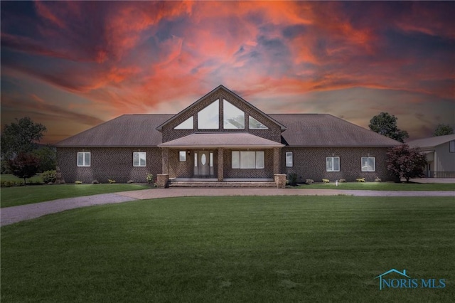 586 N State Route 587, Fostoria, OH 44830 - view of front of property featuring a front lawn, covered porch, and driveway