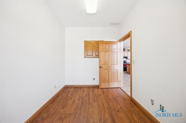 586 N State Route 587, Fostoria, OH 44830 - unfurnished room featuring wood finished floors and baseboards