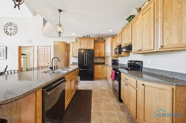 586 N State Route 587, Fostoria, OH 44830 - kitchen with black appliances, under cabinet range hood, hanging light fixtures, dark stone countertops, and light tile patterned floors