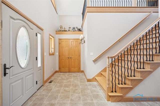 586 N State Route 587, Fostoria, OH 44830 - entrance foyer with stairs and a high ceiling