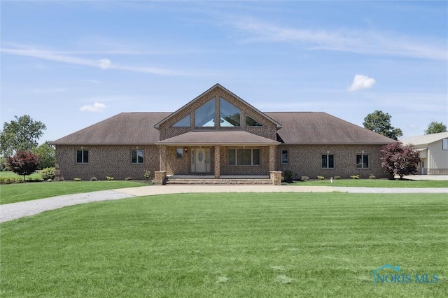 586 N State Route 587, Fostoria, OH 44830 - view of front of home with a front lawn and covered porch