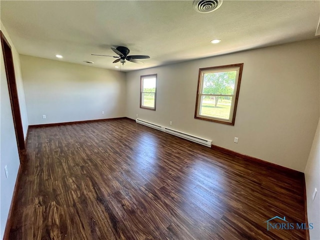 17988 Rd 156, Paulding, OH 45879 - unfurnished room with baseboard heating, ceiling fan, dark wood finished floors, and recessed lighting