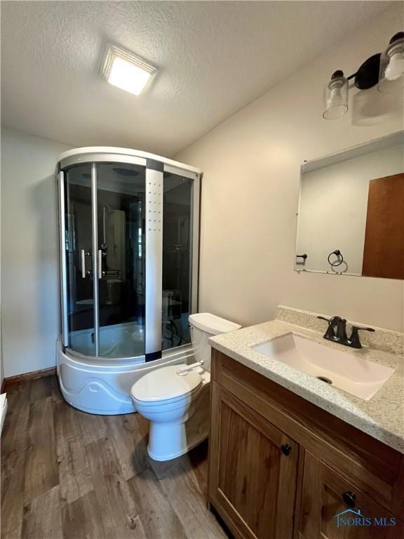 17988 Rd 156, Paulding, OH 45879 - full bath featuring vanity, wood finished floors, and a textured ceiling