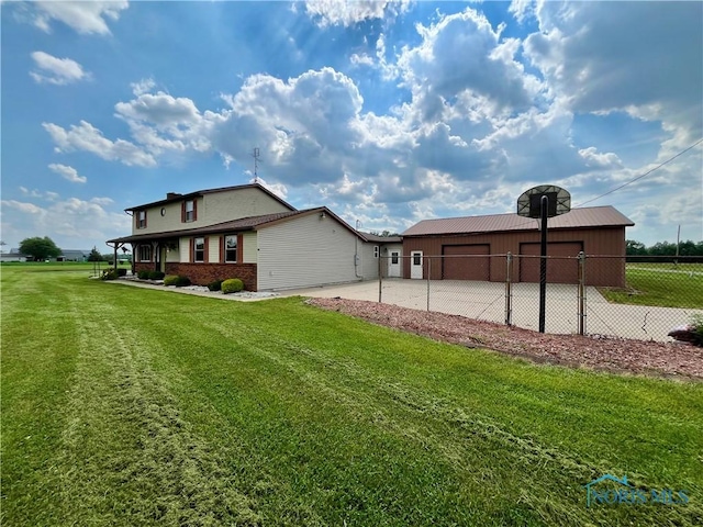 17988 Rd 156, Paulding, OH 45879 - back of property with an outdoor structure, brick siding, and an outbuilding