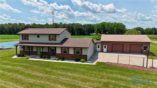 17988 Rd 156, Paulding, OH 45879 - view of front of home with covered porch, an attached garage, driveway, and brick siding