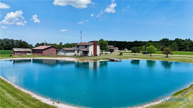 17988 Rd 156, Paulding, OH 45879 - view of swimming pool featuring a water view and a yard