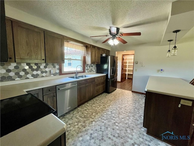 17988 Rd 156, Paulding, OH 45879 - kitchen with black appliances, ceiling fan, backsplash, a textured ceiling, and light countertops