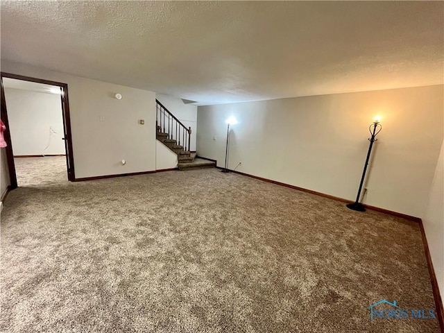 17988 Rd 156, Paulding, OH 45879 - unfurnished living room with carpet flooring, stairs, and a textured ceiling