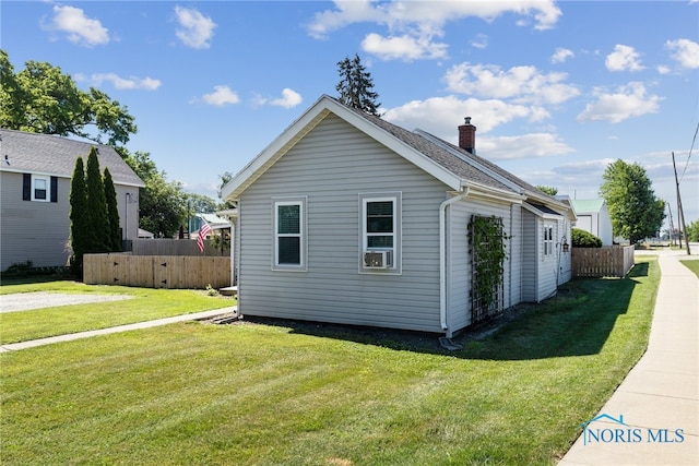 18735 Wall St, Tontogany, OH 43565 - view of property exterior with a chimney