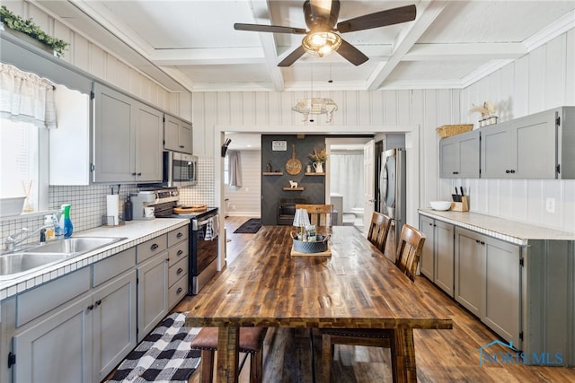 18735 Wall St, Tontogany, OH 43565 - kitchen featuring gray cabinets, appliances with stainless steel finishes, a ceiling fan, coffered ceiling, and light countertops