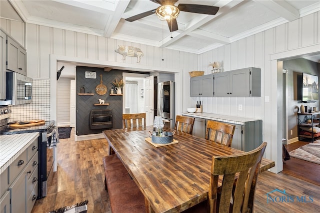 18735 Wall St, Tontogany, OH 43565 - dining space featuring dark wood finished floors, a ceiling fan, beamed ceiling, coffered ceiling, and crown molding