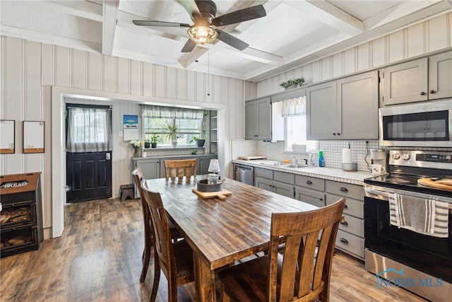 18735 Wall St, Tontogany, OH 43565 - kitchen with stainless steel appliances, gray cabinetry, coffered ceiling, light countertops, and ceiling fan