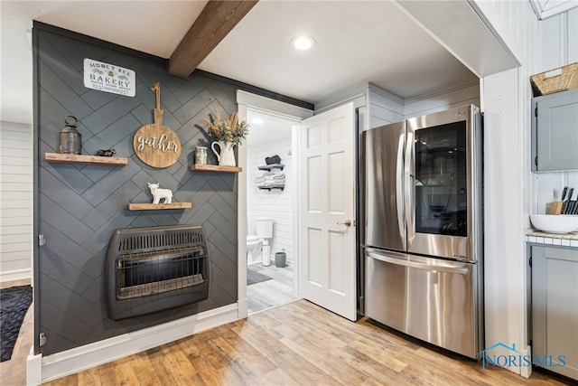 18735 Wall St, Tontogany, OH 43565 - kitchen featuring smart refrigerator, heating unit, light wood finished floors, beamed ceiling, and light countertops
