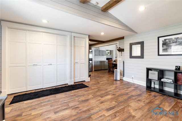 18735 Wall St, Tontogany, OH 43565 - unfurnished living room with wood finished floors, wooden walls, and recessed lighting