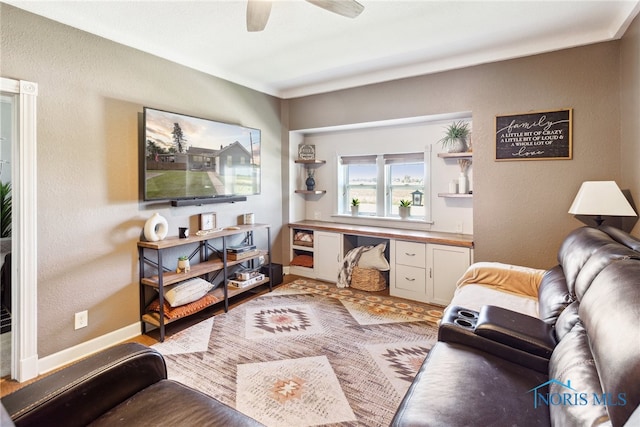 18735 Wall St, Tontogany, OH 43565 - living area with a ceiling fan, a desk, and a textured wall
