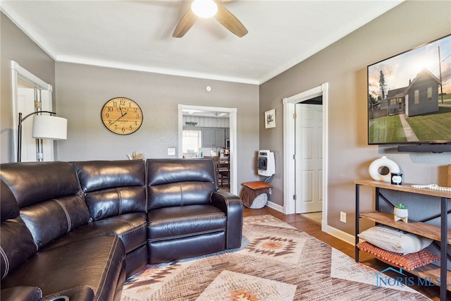 18735 Wall St, Tontogany, OH 43565 - living room with ceiling fan, heating unit, and wood finished floors