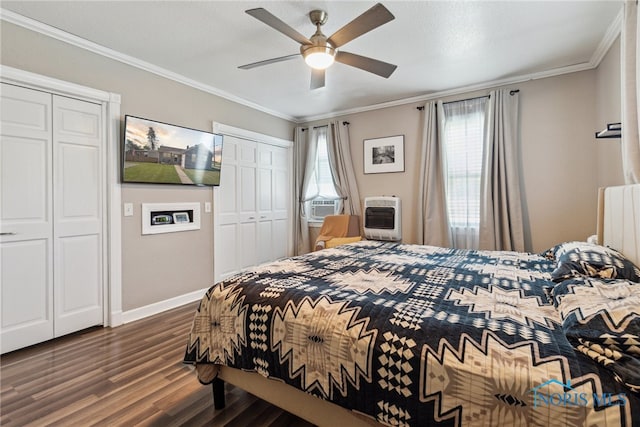 18735 Wall St, Tontogany, OH 43565 - bedroom featuring multiple closets, wood finished floors, heating unit, crown molding, and ceiling fan