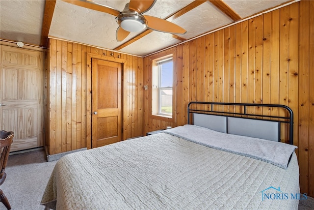 18735 Wall St, Tontogany, OH 43565 - carpeted bedroom featuring wooden walls and ceiling fan