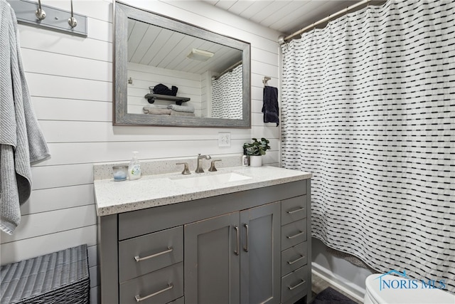 18735 Wall St, Tontogany, OH 43565 - full bathroom with vanity, wood walls, and a shower with curtain