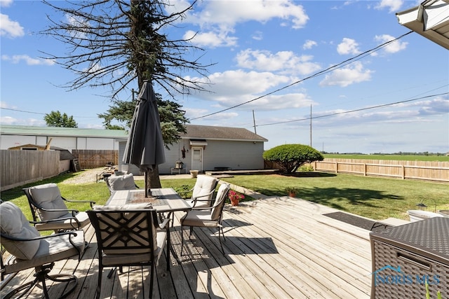 18735 Wall St, Tontogany, OH 43565 - wooden terrace with a fenced backyard, outdoor dining space, and an outdoor structure