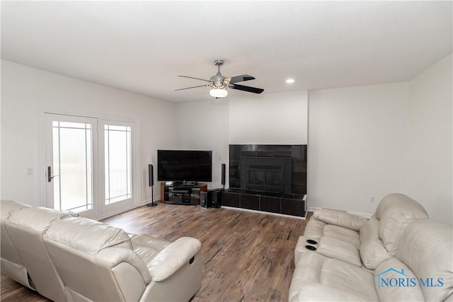 6842 Shieldwood Rd, Toledo, OH 43617 - living area with wood finished floors, recessed lighting, a ceiling fan, and a fireplace