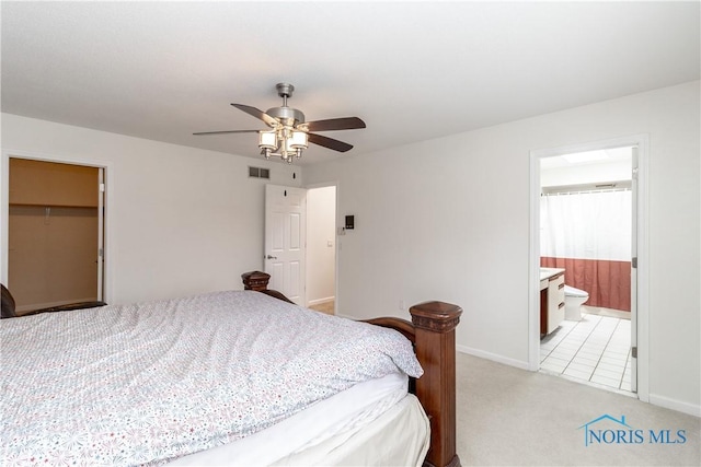 6842 Shieldwood Rd, Toledo, OH 43617 - bedroom featuring light carpet, a ceiling fan, and a walk in closet
