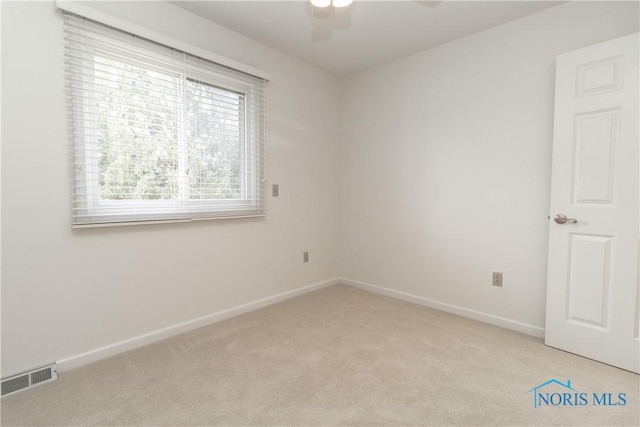 6842 Shieldwood Rd, Toledo, OH 43617 - unfurnished room with light colored carpet and a ceiling fan