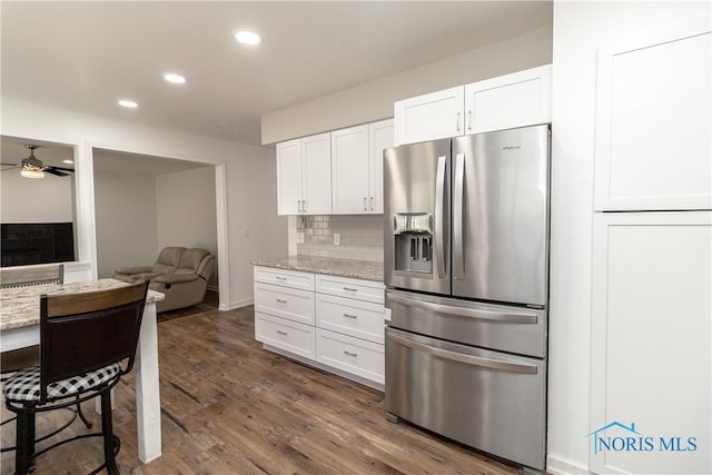 6842 Shieldwood Rd, Toledo, OH 43617 - kitchen featuring stainless steel fridge with ice dispenser, white cabinets, a ceiling fan, light stone countertops, and recessed lighting
