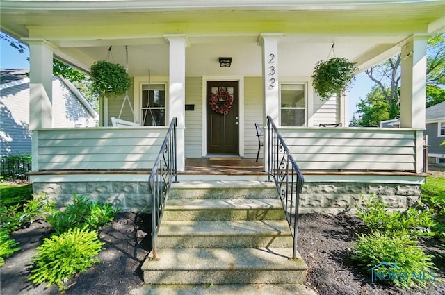 233 E 5th St, Perrysburg, OH 43551 - doorway to property with covered porch