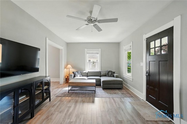 233 E 5th St, Perrysburg, OH 43551 - living area with light wood finished floors and a ceiling fan