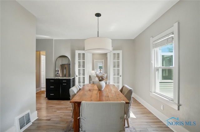 233 E 5th St, Perrysburg, OH 43551 - dining space featuring light wood-style flooring and french doors