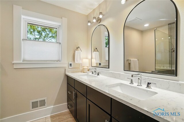 233 E 5th St, Perrysburg, OH 43551 - full bathroom featuring plenty of natural light and double vanity