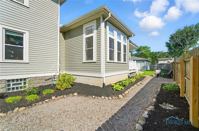 233 E 5th St, Perrysburg, OH 43551 - view of side of home with a fenced backyard