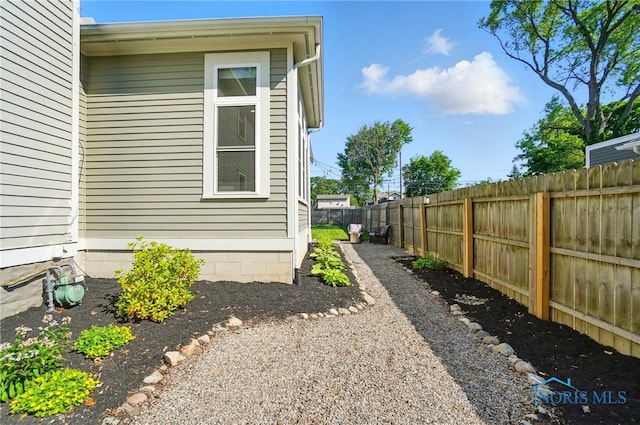 233 E 5th St, Perrysburg, OH 43551 - view of property exterior with a fenced backyard