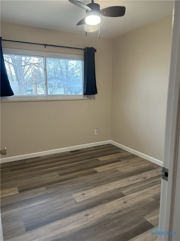 813 Maple Ln, Waterville, OH 43566 - unfurnished room featuring a ceiling fan and wood finished floors