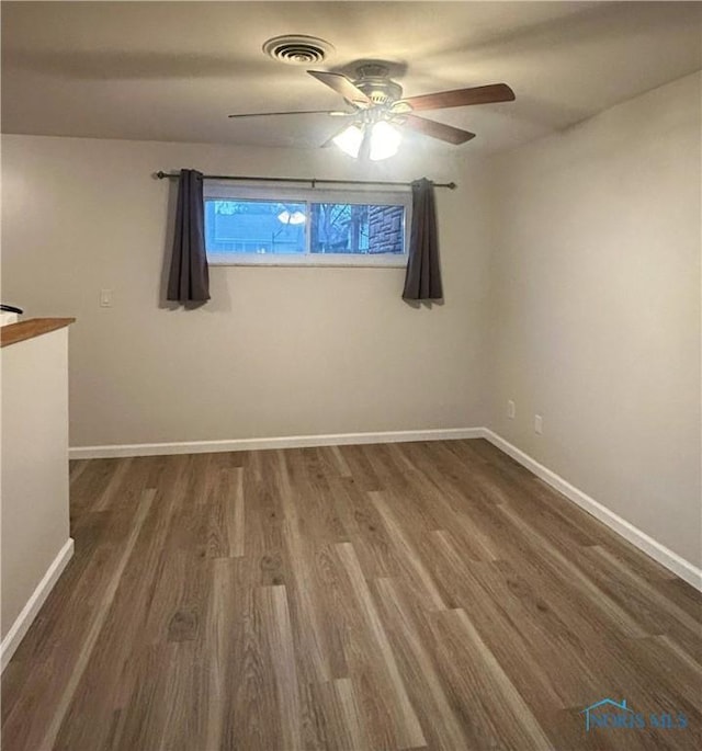 813 Maple Ln, Waterville, OH 43566 - spare room with wood finished floors and a ceiling fan