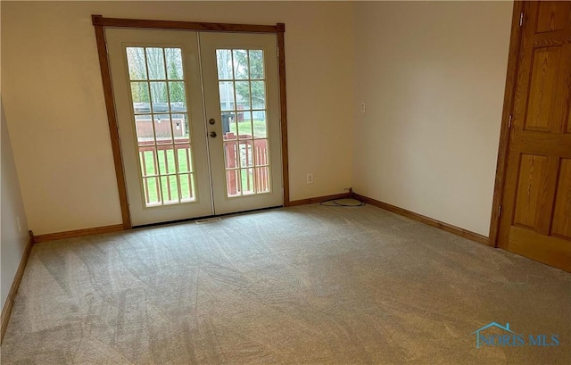 813 Maple Ln, Waterville, OH 43566 - doorway to outside featuring french doors and carpet