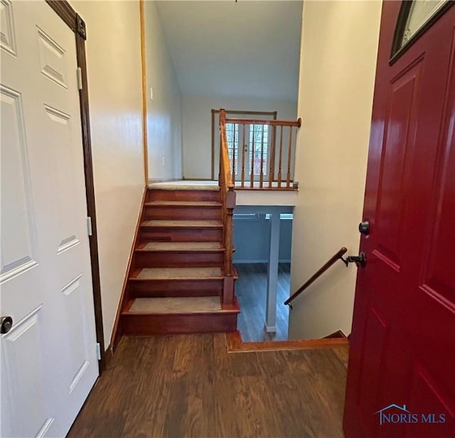 813 Maple Ln, Waterville, OH 43566 - stairs featuring wood finished floors and baseboards