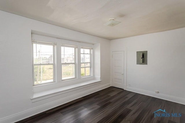 708 Spencer St, Toledo, OH 43609 - unfurnished room featuring electric panel and dark wood-style flooring
