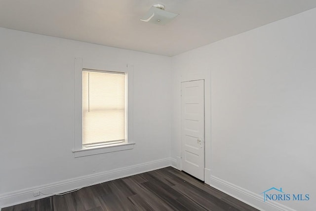 708 Spencer St, Toledo, OH 43609 - unfurnished room featuring dark wood-type flooring and baseboards