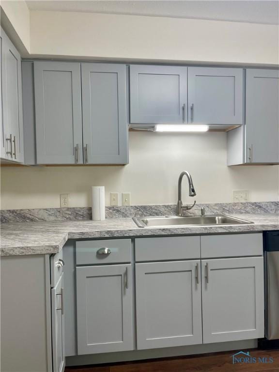 4846 Amesbury Rd, Toledo, OH 43612 - kitchen featuring dishwasher, light countertops, and gray cabinetry