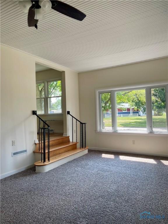 4846 Amesbury Rd, Toledo, OH 43612 - empty room featuring a ceiling fan, carpet floors, and stairway
