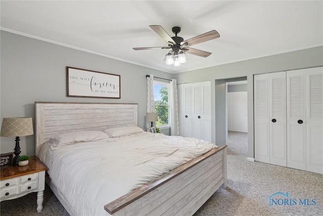 12982 State Route 34, Bryan, OH 43506 - bedroom featuring multiple closets, carpet, crown molding, and a ceiling fan