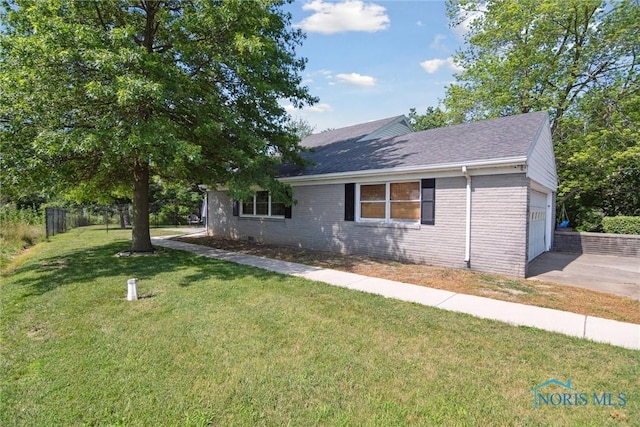 12982 State Route 34, Bryan, OH 43506 - view of front facade with a garage, concrete driveway, brick siding, and a shingled roof