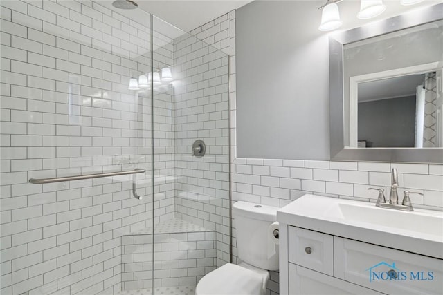 12982 State Route 34, Bryan, OH 43506 - full bath with a shower stall, vanity, and tile walls