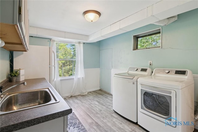 12982 State Route 34, Bryan, OH 43506 - washroom with light wood-type flooring and washing machine and dryer