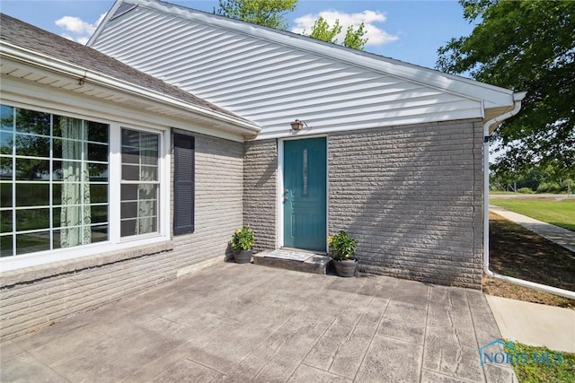 12982 State Route 34, Bryan, OH 43506 - entrance to property with a patio and brick siding